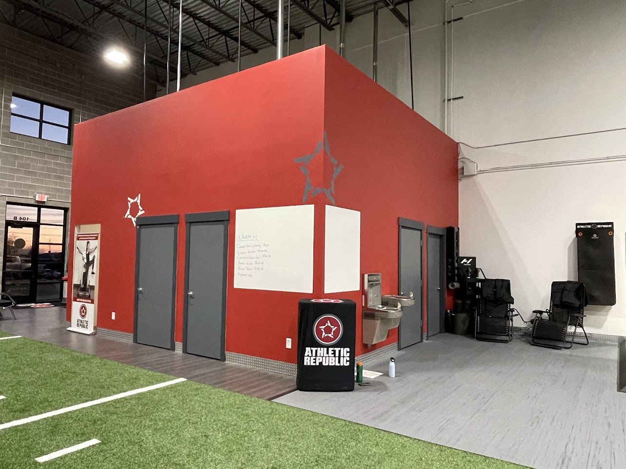 Red accent training room at Athletic Republic North Davis