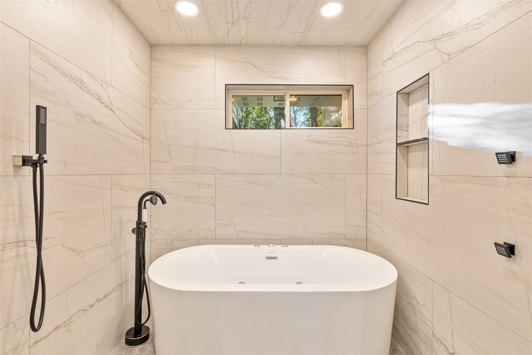 Primary bathroom soaking tub in the Eden Avrame custom home
