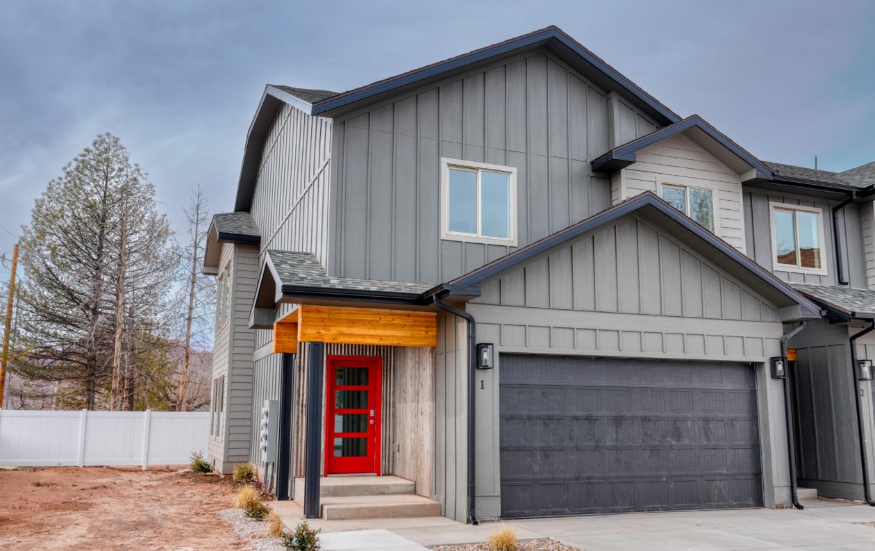 Moab Townhome Complex front entry with red door accent in Moab, Utah